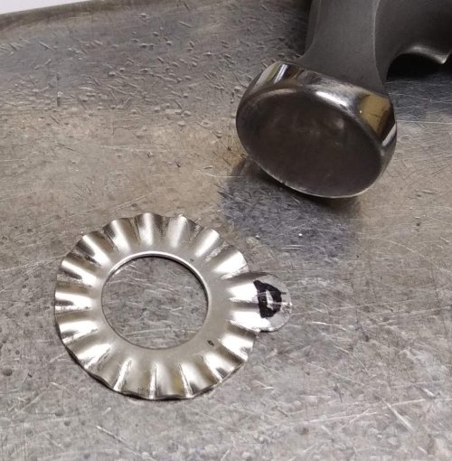 Judy Larson's Ripple Bracelet  - , Metalwork, Cutting, Cutting Tool, Cutters, Dapping, Dapping Jewelry, Filing, Finishing, Findings, Clasps, Components, Tumbling, Tumble, Tumbling Jewelry, Butane Torch, Soldering, Solder, Tools,  Use a flat faced hammer to flatten the flange.     